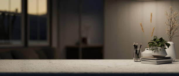 istock A presentation space on a table in a modern dark room with dim light. 2067155138