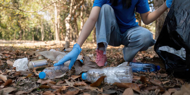 istock Separating waste to freshen the problem of environmental pollution and global warming, plastic waste, care for nature. Volunteer concept carrying garbage bags collecting the garbage 2067194889