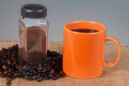 Jar of coffee bean powder - hand ground coffee to prepare coffee drinks to savor