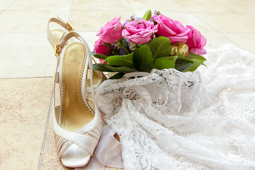Wedding shoes, bouquet and Veil with the rings