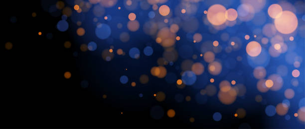 istock Blurred gold bokeh on blue background. Golden blur light effect wallpaper. Abstract shiny glitter, sparks, dust, sparkles. Vector glowing navy backdrop for Christmas, New Year, birthday card, banner 2067217260
