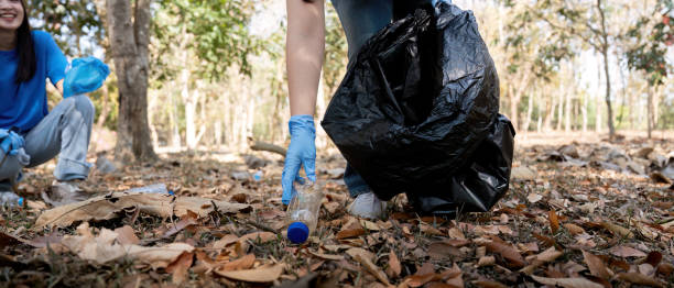 istock Separating waste to freshen the problem of environmental pollution and global warming, plastic waste, care for nature. Volunteer concept carrying garbage bags collecting the garbage 2067288337