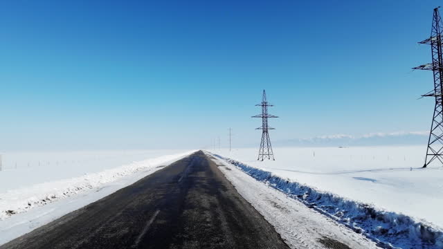 Snow road in winter steppe