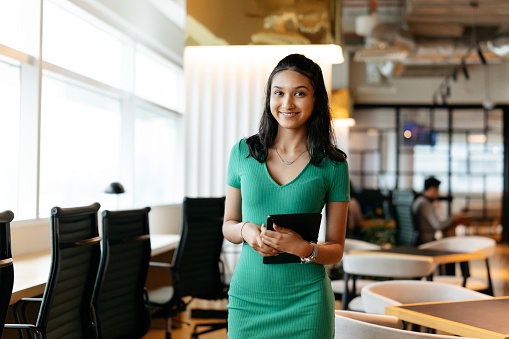 Portrait shot of a young Indian businesswoman in office