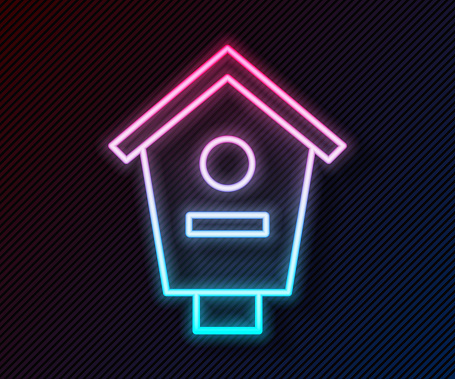 Glowing neon line Bird house icon isolated on black background. Nesting box birdhouse, homemade building for birds. Vector.