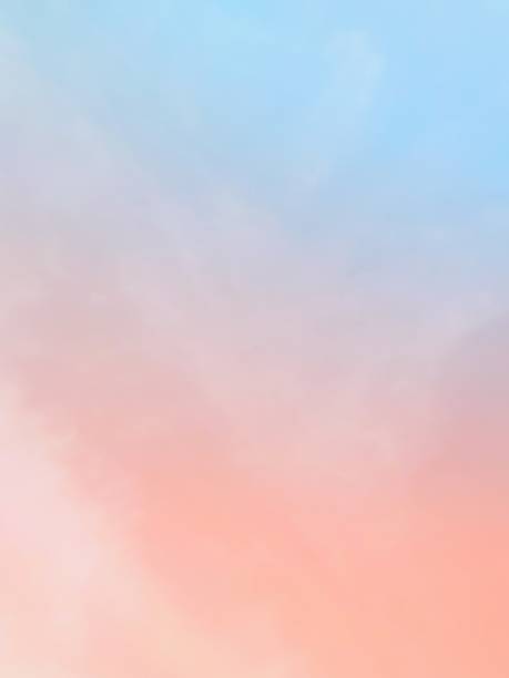 The subtlety of the soft faded clouds  On the background of the twilight sky, pastel gradients  Beautiful combinations of yellow, pink, orange, red, purple and blue.