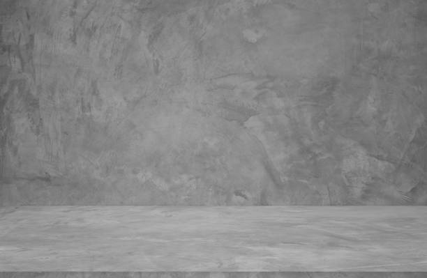 istock Wall background and backdrop of concrete cement wall in black and gray tones. Studio interior background and empty space Decorating ideas 2067520138