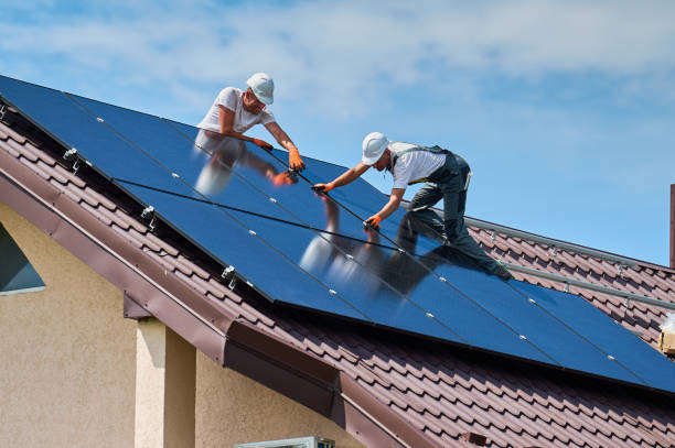 istock Workers building solar panel system on roof of house. Men installing photovoltaic solar module 2067569633