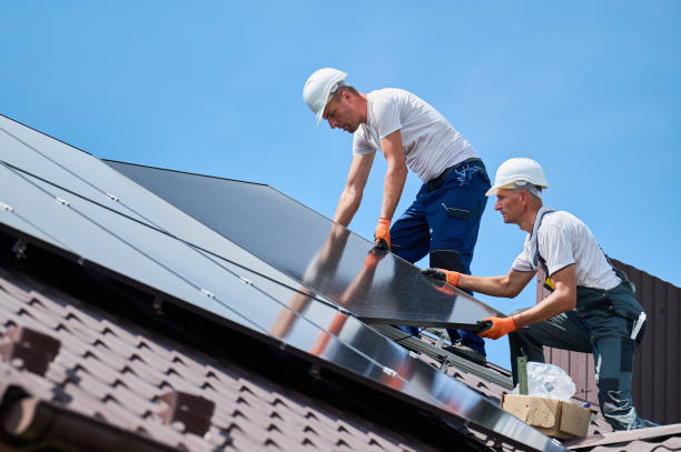 istock Workers building solar panel system on roof of house. Men installing photovoltaic solar module 2067569643