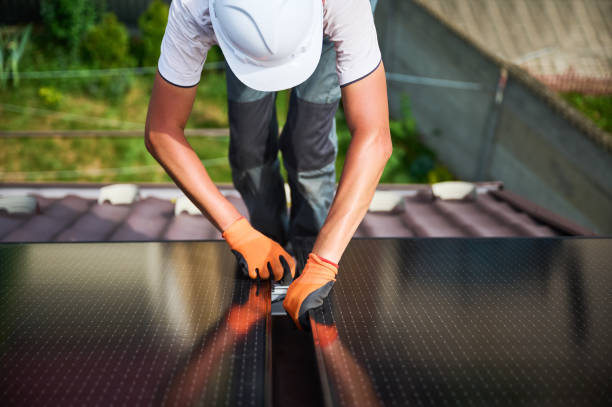 istock Workers building solar panel system on roof of house. Men installing photovoltaic solar module 2067569659