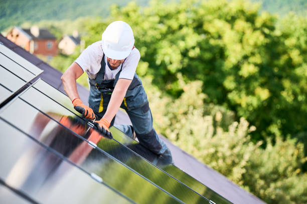 istock Worker building photovoltaic solar panel system on rooftop of house with help of hex key. 2067569934