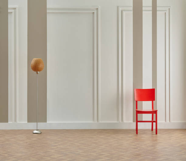 istock Decorative white and brown vertical wall background, home design, sofa working table, red chair, vase of plant, book accessory, lamp, middle table on the modern wood parquet. 2067571807