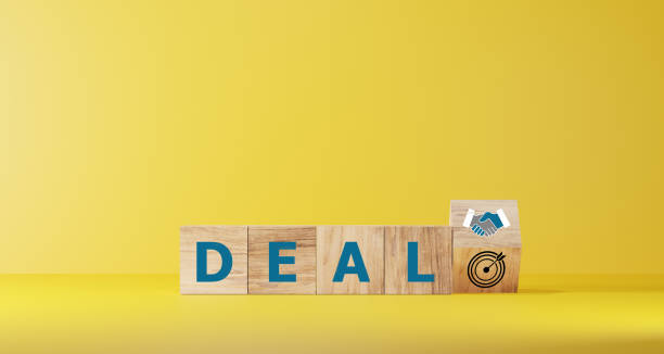 istock Dice form the words DEAL on wooden cube block for business start up concept. 2067596310