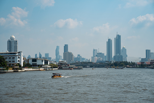 Cruise on the Chao Phraya River and cityscape of Bangkok.