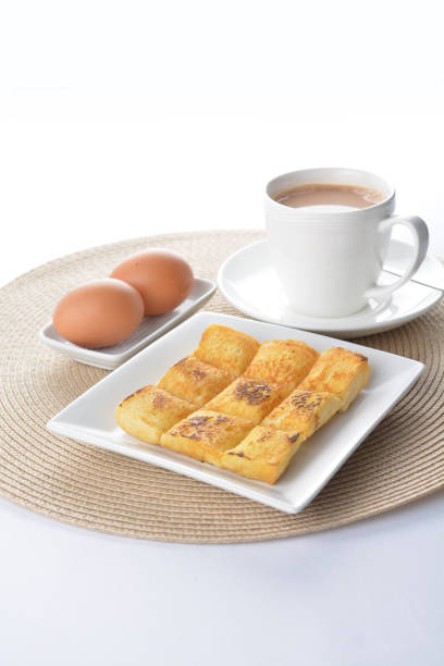 square fried egg French toast bread set with half boiled soft chicken egg and hot coffee or tea breakfast on white background asian chef appetiser halal bakery food restaurant pastry menu for cafe