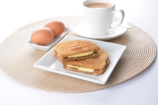 square butter kaya jam toast bread set with half boiled soft chicken egg and hot coffee or tea breakfast on white background asian chef appetiser halal bakery food restaurant pastry menu for cafe