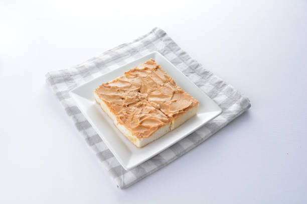 square peanut butter jam toast bread set with half boiled soft chicken egg and hot coffee or tea breakfast on white background asian chef appetiser halal bakery food restaurant pastry menu for cafe