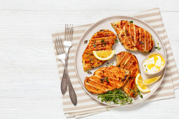 istock juicy grilled chicken cutlets on plate, top view 2067637191