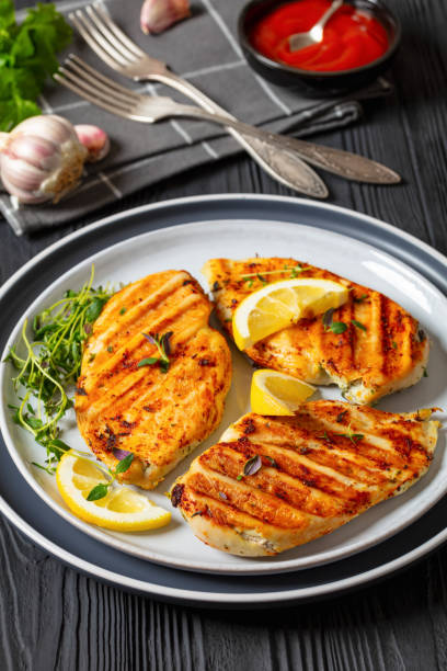 istock juicy grilled chicken cutlets on plate, top view 2067637209