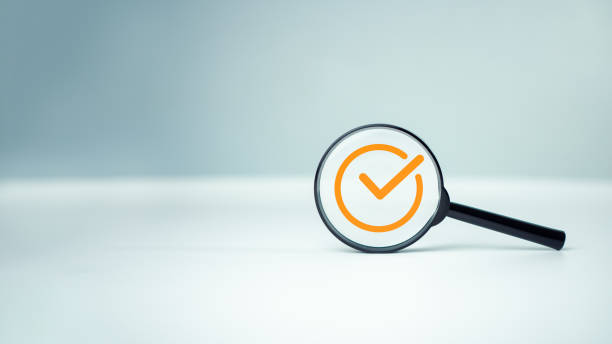 istock Checkmark to approve, Magnifying glass focus to Approve document icon on white background for business process workflow illustrating management approval and and project approve concept. 2067660151