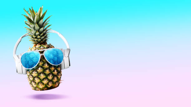istock Happy pineapple listening to music 2067662809