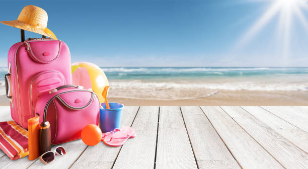 istock Luggage and accessories at the beach 2067663356