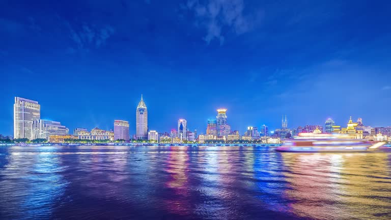 Time-lapse shot of urban commercial buildings skyline in Shanghai at night