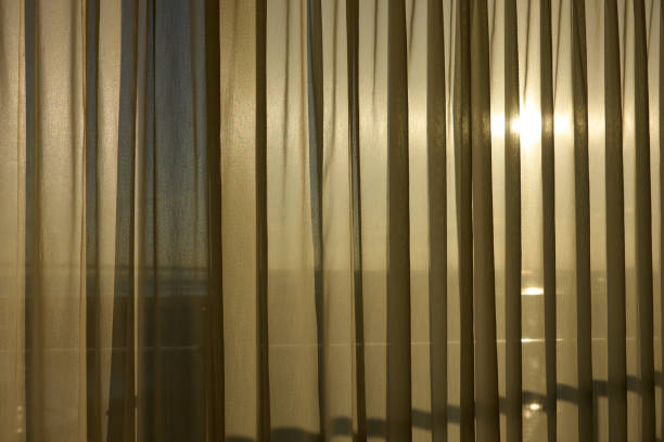 istock The sunrise seen through the curtains 2067666524