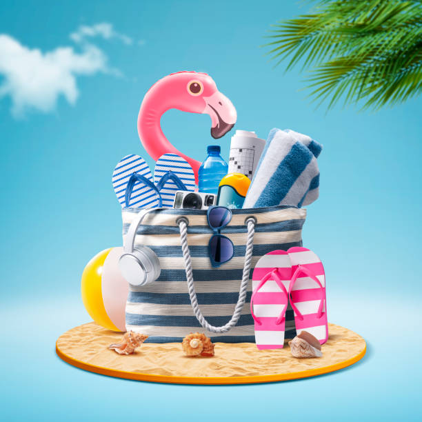 istock Beach bag with accessories and cute inflatable flamingo 2067668110