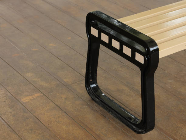 istock Brown garden bench for relaxing in the park 2067677279