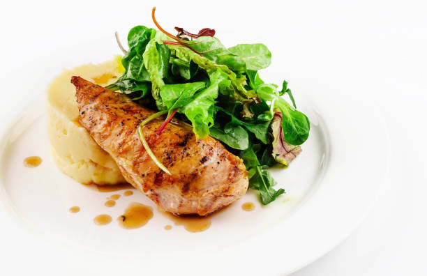 istock Baked chicken breast with mashed potatoes and arugula 2067694676