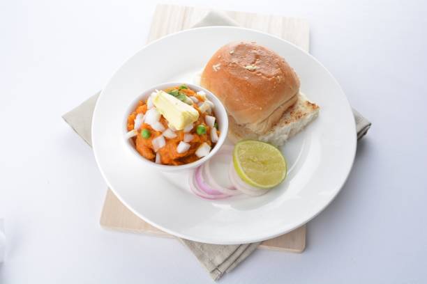 istock indian vegetable bean curry with baked bread bun burger toast onion lime breakfast on white background asian chef appetiser halal bakery food restaurant pastry menu for cafe 2067703910