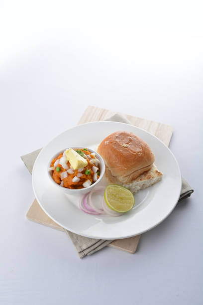 istock indian vegetable bean curry with baked bread bun burger toast onion lime breakfast on white background asian chef appetiser halal bakery food restaurant pastry menu for cafe 2067704959