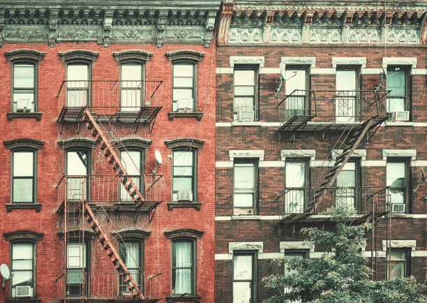 istock Old buildings with fire escapes, color toning applied, New York 2067710239