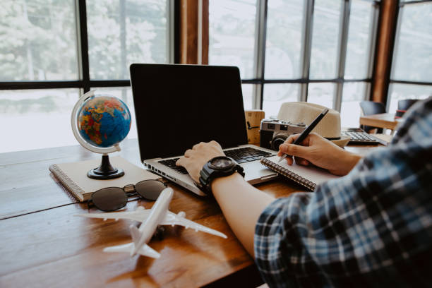 istock Young man writing his travel planning. 2067732031