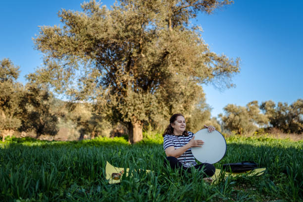 Senior woman meditating in nature