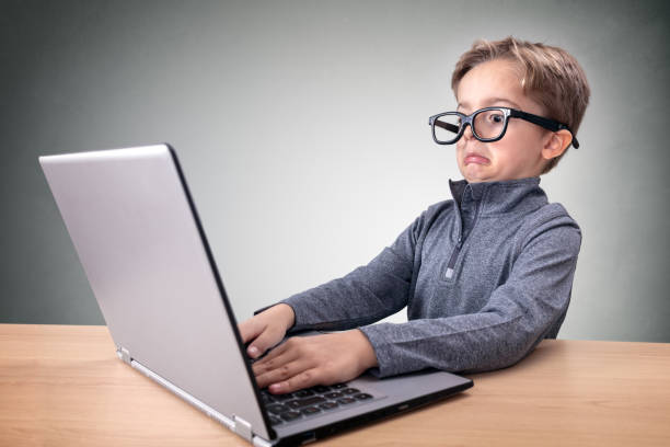 Shocked and surprised boy on the internet with laptop computer concept for making a mistake, amazement, astonishment, stunned and speechless or seeing something he shouldn't see