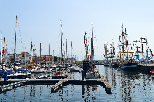 A Coruna, Spain – August 12, 2016: A Row of sailboats docked at the dock, in Galicia, Spain