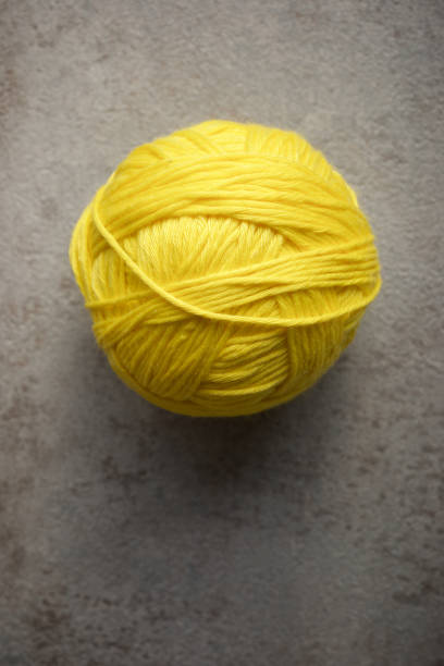 Close up of a group of yellow wool ball on a table