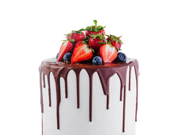 istock White cake with melted dark chocolate with fresh berries 2067774963