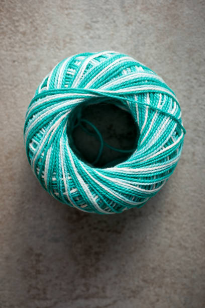 Close up of a group of green and white wool ball on a table