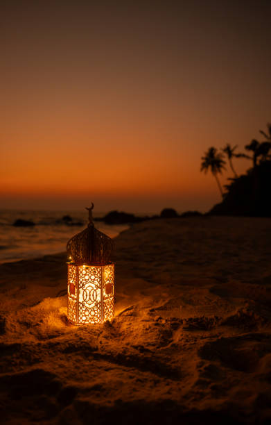 istock Ramadan lantern lamp,illuminated Ramadan lamp on the beach 2067786939