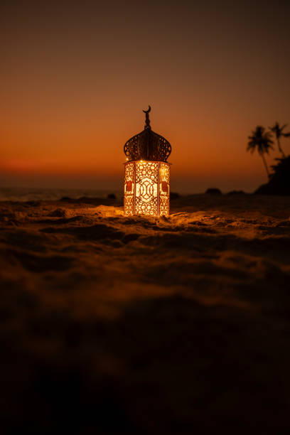 istock New Eid Mubarak background design, Ramadan Lantern Lamp with sunset sky, Islamic concept image 2067787471