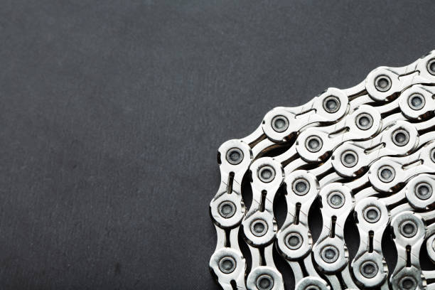 Shiny mountain bike chain on dark background with free space