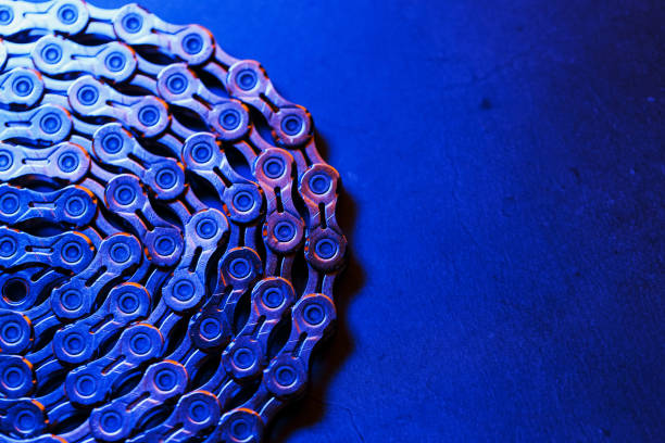 The texture of a bicycle chain is a close-up of the torque transmission links in full screen