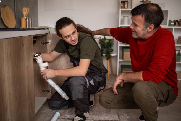 istock Young repairman fixing a kitchen sink 2067854050