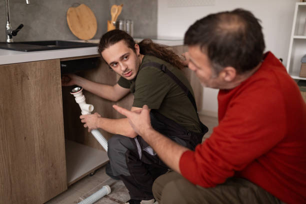 istock Young repairman fixing a kitchen sink 2067854063