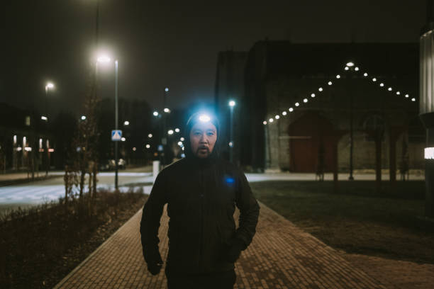 Photo series of midnight running in the cold weather during winter and early spring with head light and city map.
