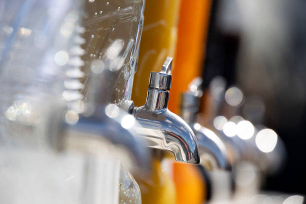 Tap Drink Dispenser in a row, illuminated by natural light with blurred background