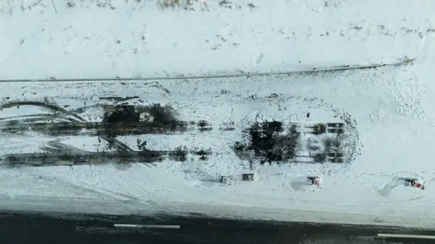 Photo of Drone photography of lorry accident site and burned up asphalt in a highway during winter cloudy morning